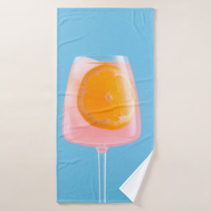 Oranje sap in helder drink glas badhanddoek