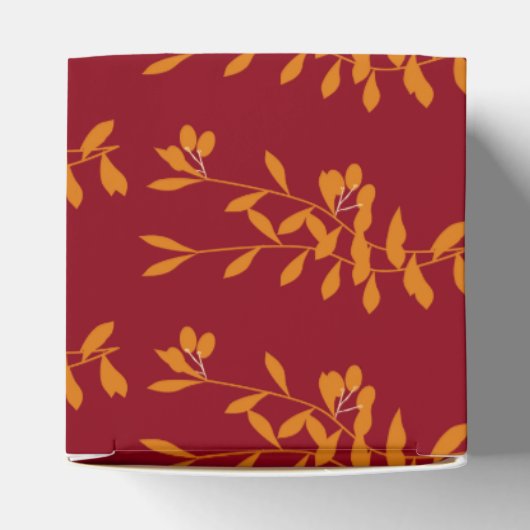 Oranje silhouetbladeren op rood bedankdoosjes (Bovenkant)