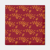 Oranje silhouetbladeren op rood magneet (Voorkant)