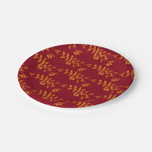 Oranje silhouetbladeren op rood papieren bordje (Gekanteld)