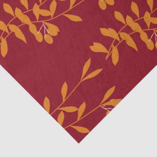 Oranje silhouetbladeren op rood tissuepapier (Detail)