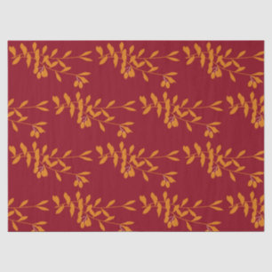 Oranje silhouetbladeren op rood tissuepapier