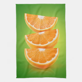 Oranje stukken op groen theedoek