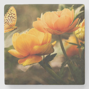 Oranje vlinder en bloemen stenen onderzetter