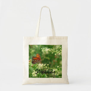 Oranje vlinder met persoonlijke naam katoen tote bag