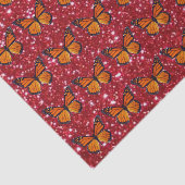 Oranje vlinder op papier met rode glitter (Detail)