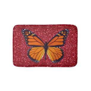 Oranje vlinder op rode glitter bath mat