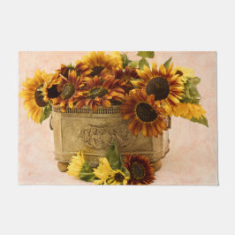 Oranje zonnebloemen in tin mandje deurmat