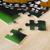 Oranje, zwarte en witte vlinder op blad legpuzzel (Zijkant)