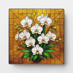 Orchideeën in een glas-in-loodkunstwerk met goud fotoplaat