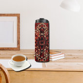 Orientaal tapeontwerp in donkerrood thermosbeker