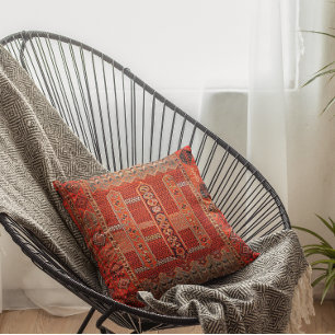 Orientaal tapeontwerp in felle sinaasappels kussen