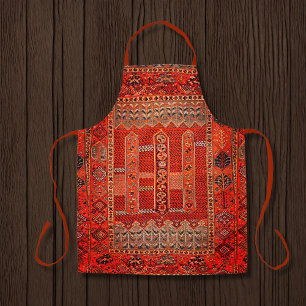 Orientaal tapeontwerp in felle sinaasappels schort