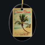 Ormond Beach Palm Tree Vintage Travel Keramisch Ornament<br><div class="desc">A uniquely retro mid-century modern Ormond Beach Florida art print in vintage travel poster style. It features a curved palm tree on sandy beach with ocean under a blue cloudy sky.</div>