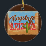 Ornament Arizona Desert Vintage<br><div class="desc">Flagstaff Arizona neo vintage reisontwerp in een grappige cartoon retro-stijl met de woestijn,  een cactus en rotsen. Blauw,  bruin en rood met groene cactus.</div>