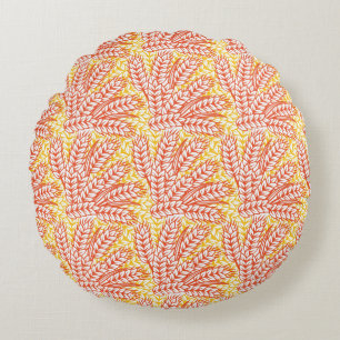 Ornament met tarweoren rond kussen