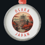 Osaka Japan Retro Noodlijdende Cirkel Metalen Ornament<br><div class="desc">Osaka retro vector reisontwerp. Het staat bekend om zijn moderne architectuur,  nachtleven en stevig straatvoedsel. Het 16e-eeuwse shogunaat van het kasteel van Osaka,  dat verschillende restauraties heeft ondergaan,  is zijn belangrijkste historische bezienswaardigheid.</div>