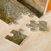 Otter die een smaakvis eet van zijn hond, legpuzzel (Zijkant)