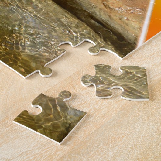 Otter die een smaakvis eet van zijn hond, legpuzzel (Zijkant)