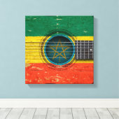 Oude akoestische gitaar met Ethiopische vlag Canvas Afdruk (Insitu (Houten vloer))