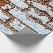 Oude  bakstenen wand met gestrooid wit gipsplaat cadeaupapier (Hoek)