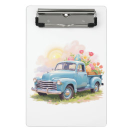 Oude blauwe vrachtwagen met paaseieren en tulpen mini klembord