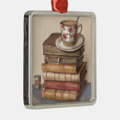 Oude  boeken en een kopje koffie metalen ornament (Rechts)
