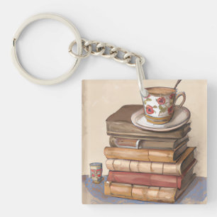 Oude  boeken en een kopje koffie sleutelhanger