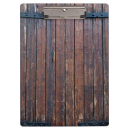 Oude bruine houten deuren met zwarte ijzersteunen klembord