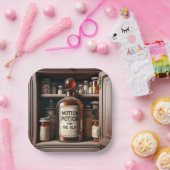 Oude fles in een medicijnkastje papieren bordje (Feest)