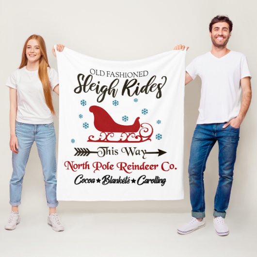 Oude, gevlekte slee met kersttang fleece deken (In situ)