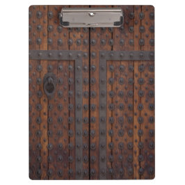 Oude houten deur met zwarte metalen versterkingen klembord