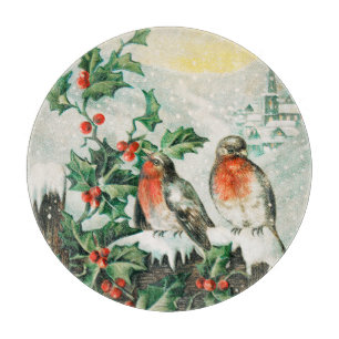 Oude kerstkaart met roodborstjes, hulst en kerk snijplank