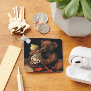 Oude kerstspullen, pop en teddybeer sleutelhanger