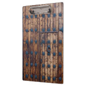 Oude kleine deur binnen grote versterkte houten de klembord (Links)