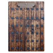 Oude kleine deur binnen grote versterkte houten de klembord (Voorkant)