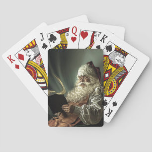 Oude Man kerstman die zijn lijst leest Pokerkaarten