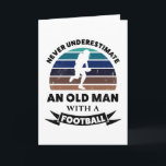 Oude man met voetbal grappig cadeau vader kaart<br><div class="desc">Onderschat nooit een oude man met een voetbal. Grappig cadeau ideaal voor mannen die van American football en sporten houden. Koop het als kerst-,  verjaardags- of vadersdagcadeau voor je man of vader.</div>