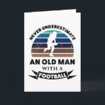 Oude man met voetbal grappig cadeau vader kaart<br><div class="desc">Onderschat nooit een oude man met een voetbal. Grappig cadeau ideaal voor mannen die van American football en sporten houden. Koop het als kerst-,  verjaardags- of vadersdagcadeau voor je man of vader.</div>