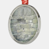 Oude muur, steen, stenen metalen ornament (Links)