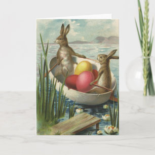 Oude Paashaasjes in een boot met Paaseieren Feestdagen Kaart