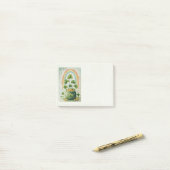Oude pot met goud en regenboog post-it® notes (Op bureau)
