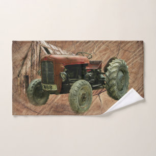Oude rode tractor roestige schuur en loods handdoek