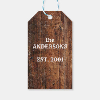Oude roestige houten persoonlijke familienaam cadeaulabel