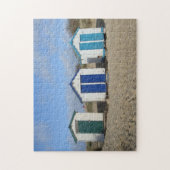 oude strandhutten en blauwe hemel Engelstalige fot Legpuzzel (Verticaal)
