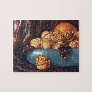 Oude voeding, walnoten en fruit in een blauwe kom legpuzzel