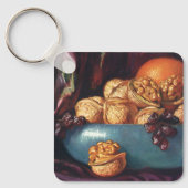 Oude voeding, walnoten en fruit in een blauwe kom sleutelhanger (Voorkant)