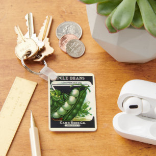 Oude zaadpakket label kunst, stok limabonen sleutelhanger