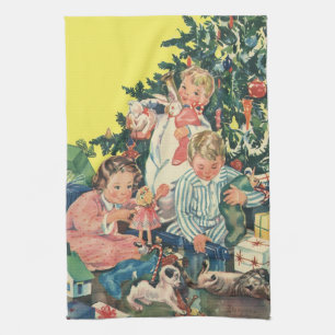 Ouderwetse kerstochtend, kinderen die cadeaus open theedoek