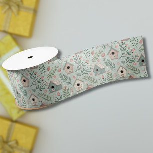 Ouderwetse pastel vogelhuisjes met bloeiende bloem satijnen lint